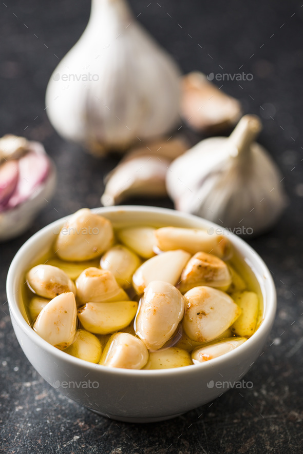 Marinated garlic. Pickled garlic. Stock Photo by jirkaejc PhotoDune